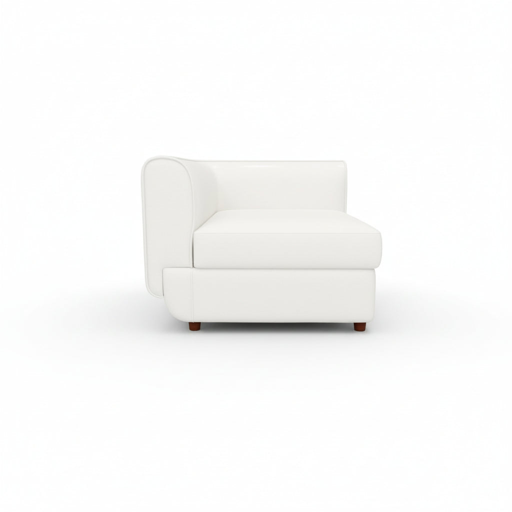 A white Rituals sofa corner unit with a cushioned backrest and seat, set against a plain background.